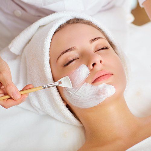 Woman having Facial Mask at Beauty Salon — Oceanport, NJ — Red Birch Spa Woman having Facial Mask at Beauty Salon — Oceanport, NJ — Red Birch Spa