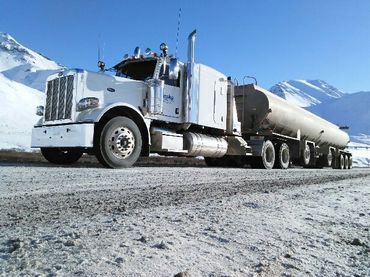 A close up of a fuel truck filling up