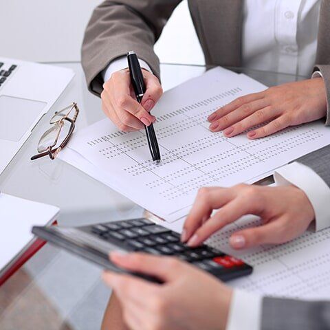 Man Checking Documents — Auditing & Compliance in Manoora, QLD