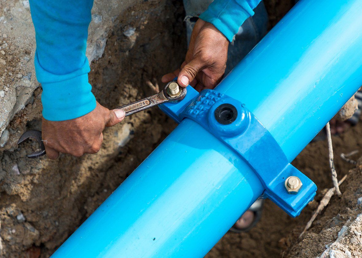 Person Fixing the Pipe — Lehighton, PA — Frable Plumbing Person Fixing the Pipe — Lehighton, PA — Frable Plumbing