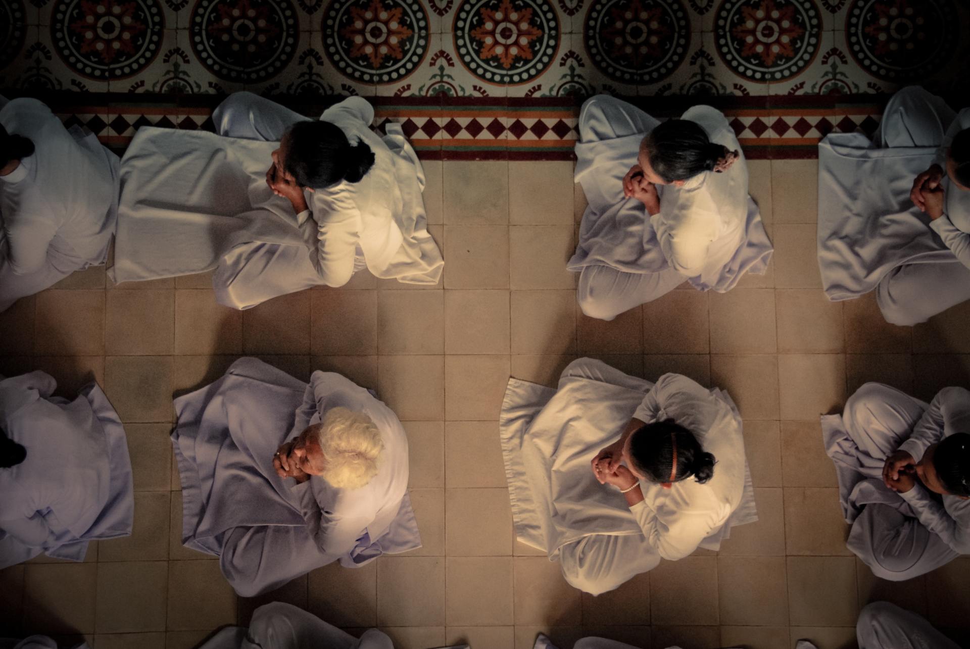 People in a group meditating