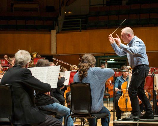 Michael Bell conducting a rehearsal