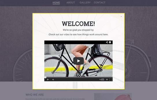 Website welcome screen with a cycling video centered on a purple background