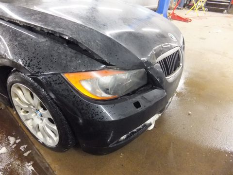 Black Car on Repair Shop — Grand Rapids, MI — Bobs Collision Service Black Car on Repair Shop — Grand Rapids, MI — Bobs Collision Service