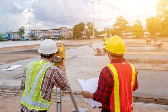 Team Working the Surveyor at the Construction Site — Jasper, AL — C&C Surveying Inc. Team Working the Surveyor at the Construction Site — Jasper, AL — C&C Surveying Inc.