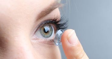 Young woman with contact lens