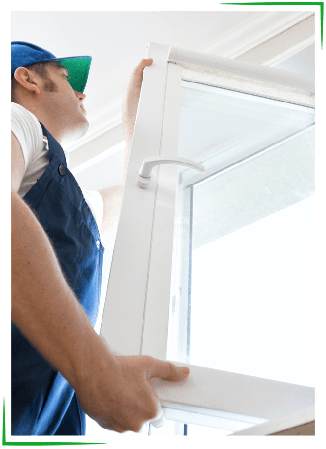 Windows - Missouri Bath & Window - Springfield, Missouri Man in blue overalls and cap installing a white window frame.