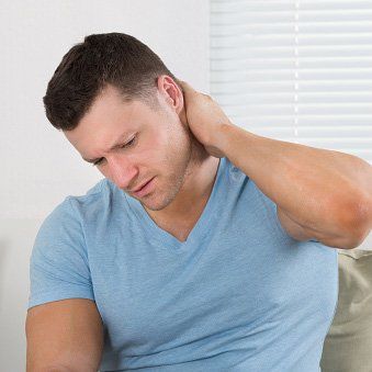 Man Touching his Neck — Pain Management in Quakertown, PA Man Touching his Neck — Pain Management in Quakertown, PA