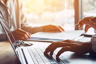 Financial Services —Accountant Using Computer in Oklahoma City, OK