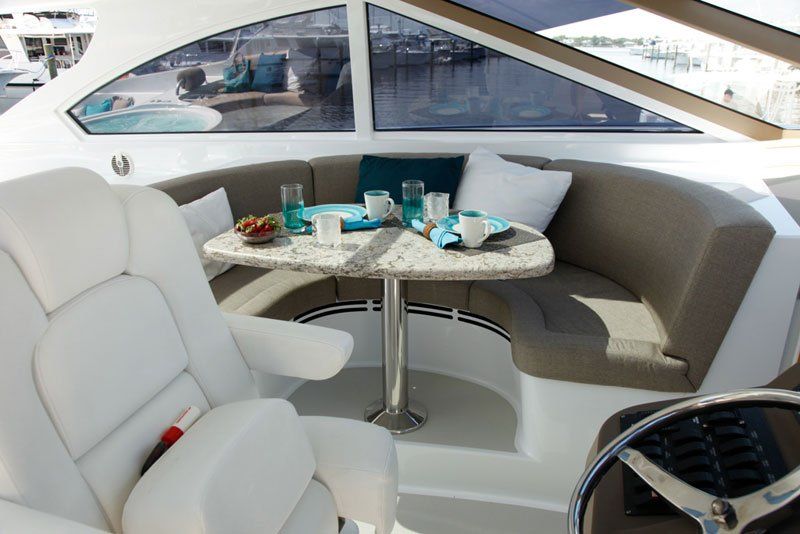 The inside of a boat with a table and chairs