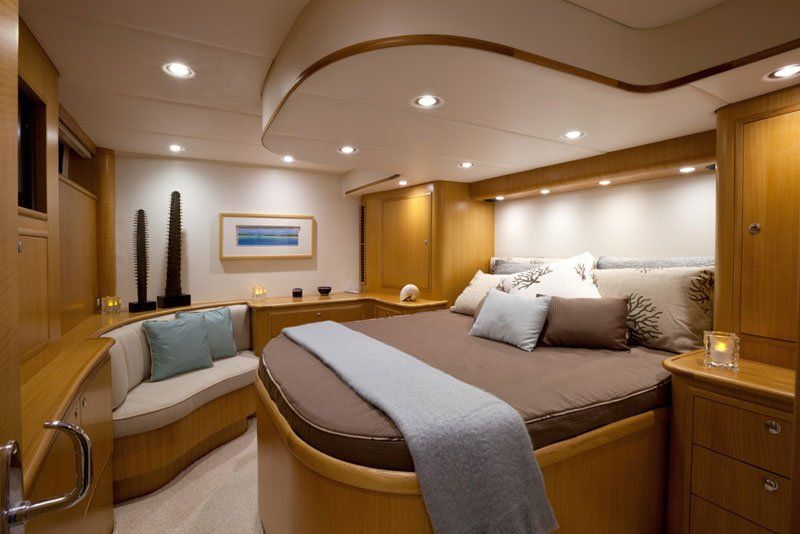 A bedroom with a large bed and a couch
