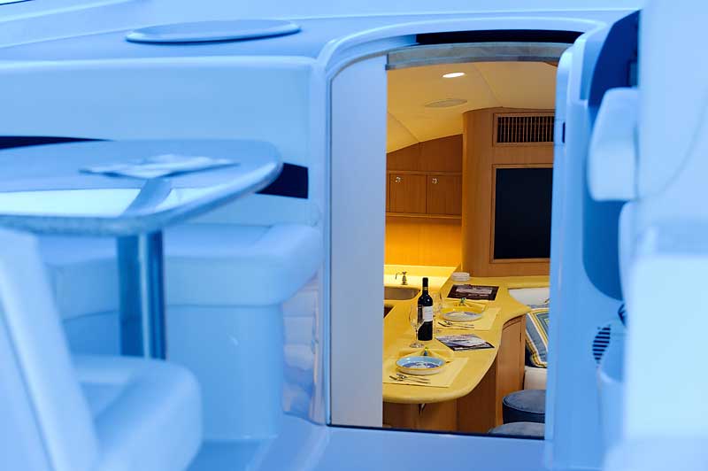 A room with a table and a bottle of wine on it