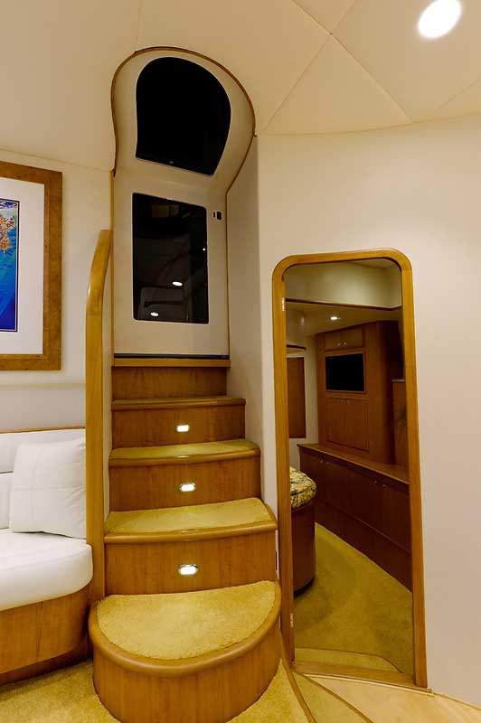 A room with stairs leading up to a window