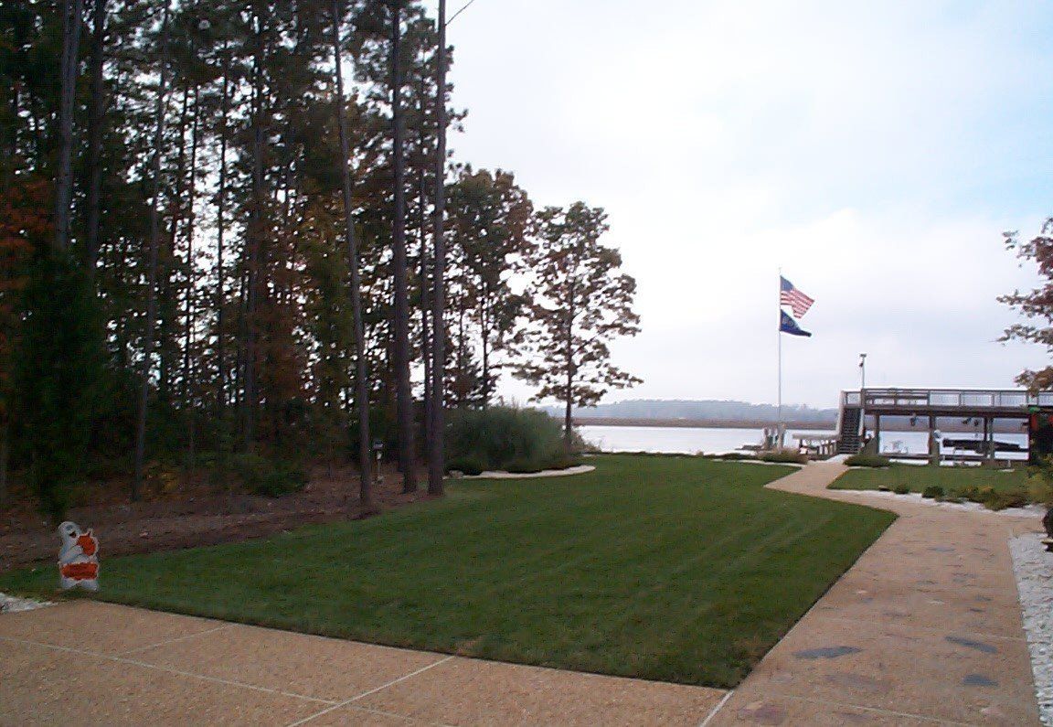 Cottages And Cabins Maintenance — Wide Field With American Flag in Shacklefords, VA