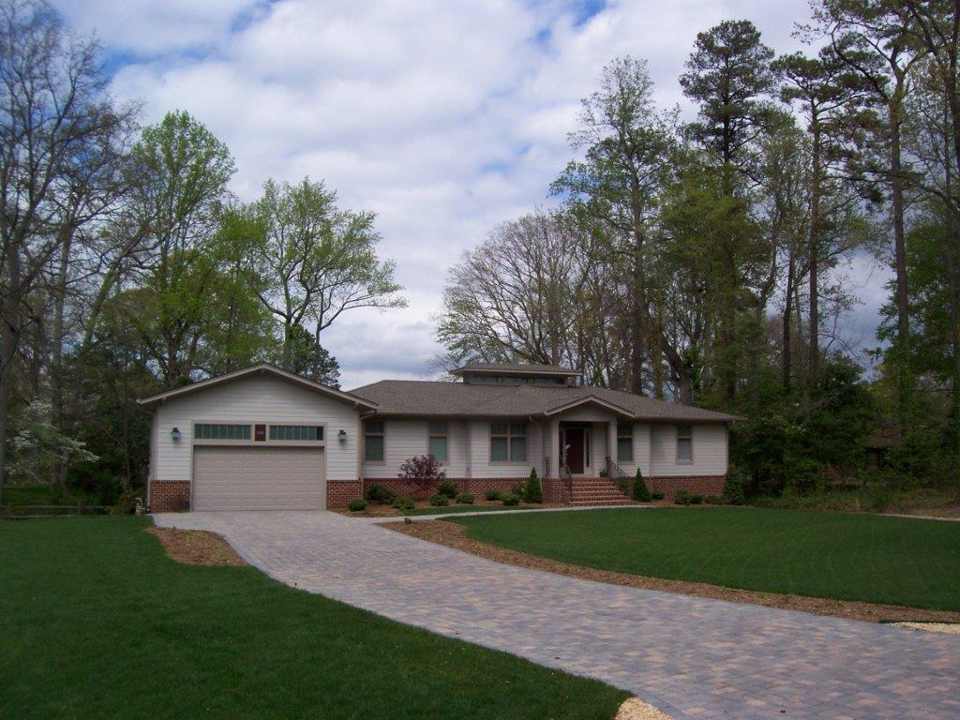 Cottages And Cabins Installation — House With Garage And Surrounding Trees in Shacklefords, VA
