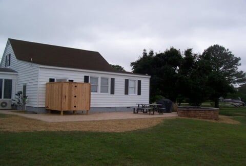 Sodding — House With Woodedn Small Container Outside in Shacklefords, VA