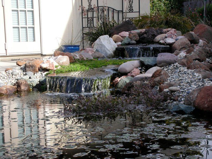 Outdoor Water Falls — Santa Cruz, CA — Quilici Gardening A home with a customized pond installation in Live Oak, CA