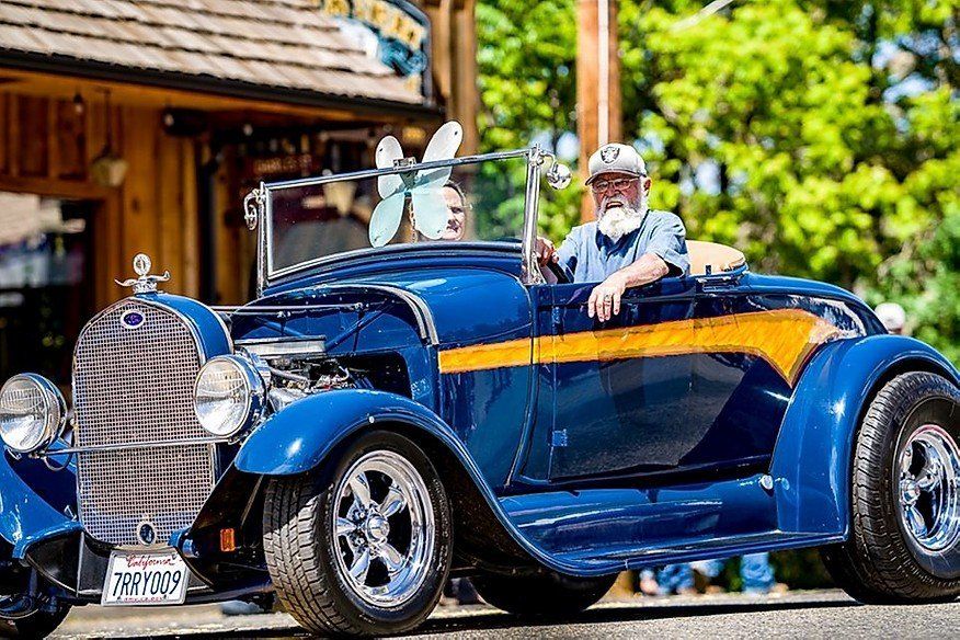 classic car driving through parade