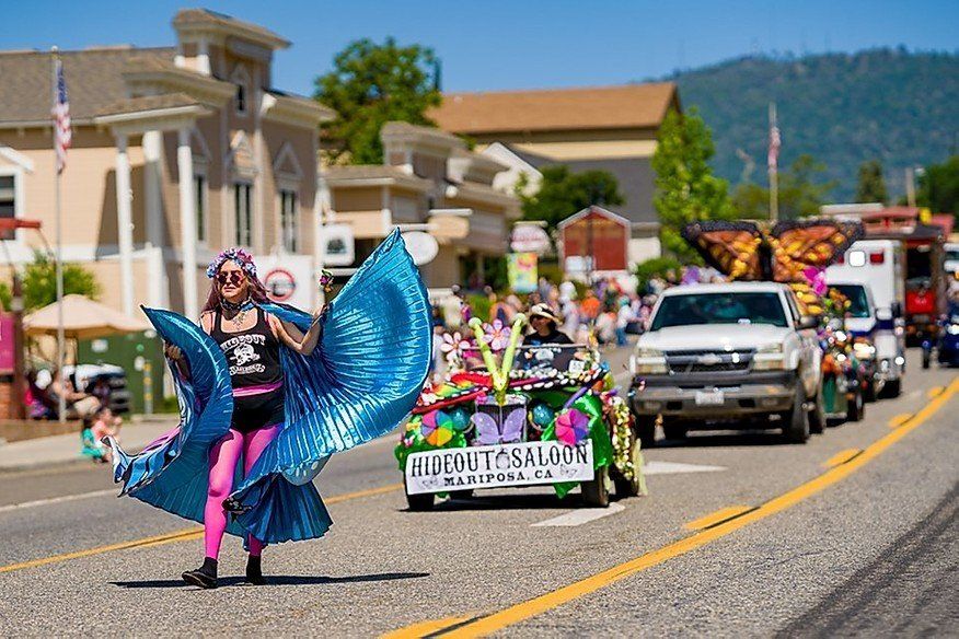 floats going through the butterfly festival parade