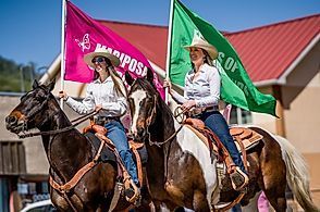 women on horses in a parade