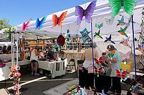 a vendor booth with butterflies