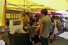 people standing at an event registration booth