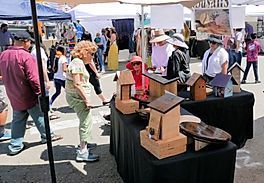 people at a bird house booth