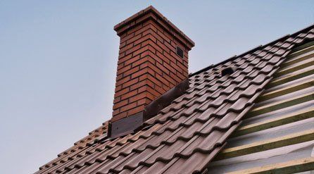 new chimney and partly tiled roof