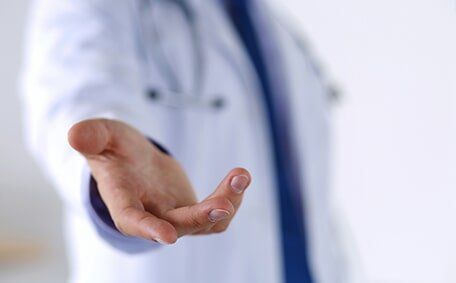 Doctor Offering Helping Hand — Medical Service in Valparaiso, IN Doctor Offering Helping Hand — Medical Service in Valparaiso, IN