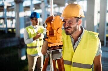 Construction Engineer Working on Building Site — Land Development & Planning Engineers in Hopkinton, MA Construction Engineer Working on Building Site — Land Development & Planning Engineers in Hopkinton, MA