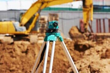 Surveyor Equipment Theodolite Outdoors — Land Development & Planning Engineers in Hopkinton, MA Surveyor Equipment Theodolite Outdoors — Land Development & Planning Engineers in Hopkinton, MA