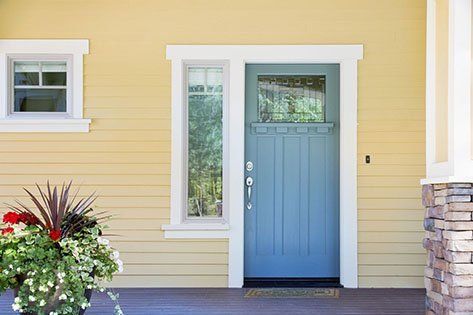 Front entrance of a home with blue door — Doors located in Las Vegas NV 89118 Front entrance of a home with blue door — Doors located in Las Vegas NV 89118
