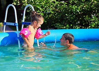 Two Children on Swimming Pool – Pool and Spa Shop in Lanesborough, MA
