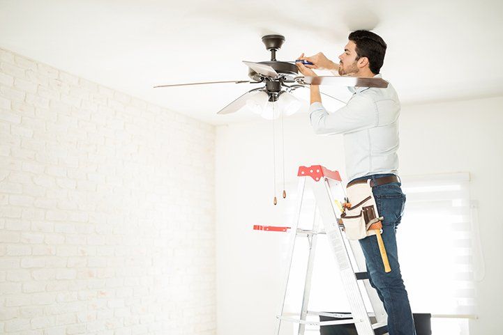 Electrician Installing Ceiling Fan — Ogden, IL — MX Electric Electrician Installing Ceiling Fan — Ogden, IL — MX Electric