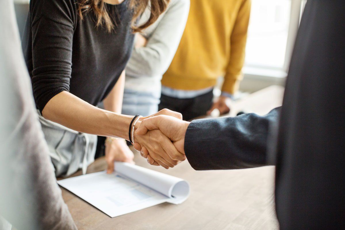 Two People Shaking Hands Photo