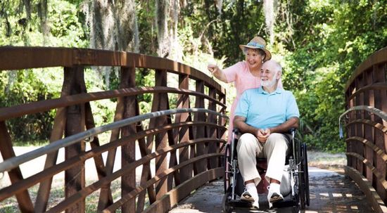 a couple on a wheel chair