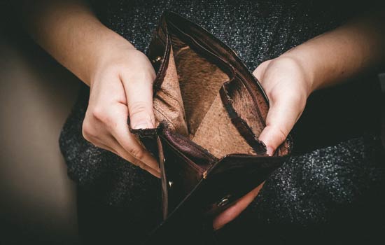 Financial Status — Man Opening His Empty Wallet in Valdosta, GA Financial Status — Man Opening His Empty Wallet in Valdosta, GA