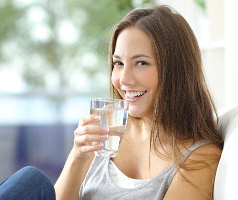 Girl Drinking Water — Terre Haute, IN — Rankin EcoWater Woman Drinking Water — Terre Haute, IN — Rankin EcoWater