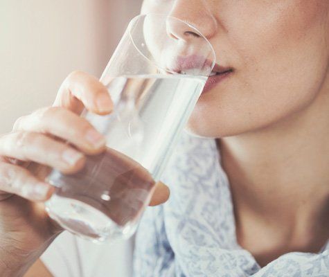Woman Drinking a Glass of Water — Terre Haute, IN — Rankin EcoWater Woman Drinking a Glass of Water — Terre Haute, IN — Rankin EcoWater