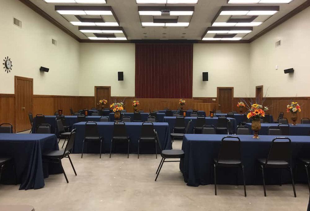 Large commercial space with tables and chairs set-up