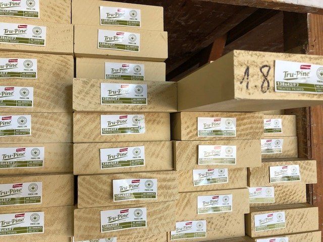 Stacked Tru-Pine timber boards.