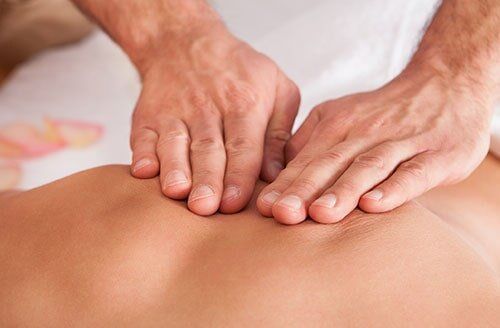 Man Having Chiropractic Back Adjustment — Chiropractic Clinics in Madisonville, TN Man Having Chiropractic Back Adjustment — Chiropractic Clinics in Madisonville, TN