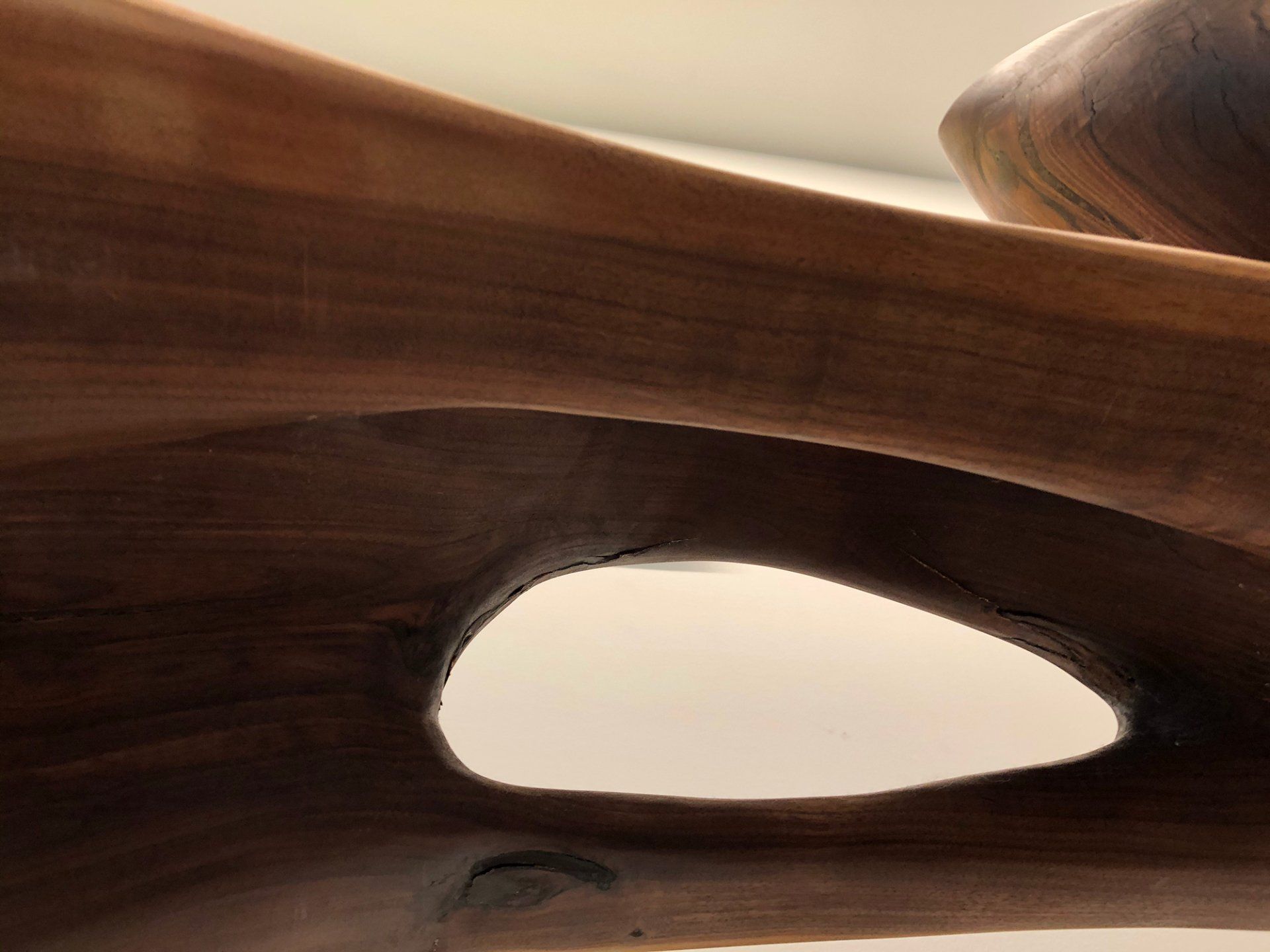 A close up of a piece of wood with a hole in it