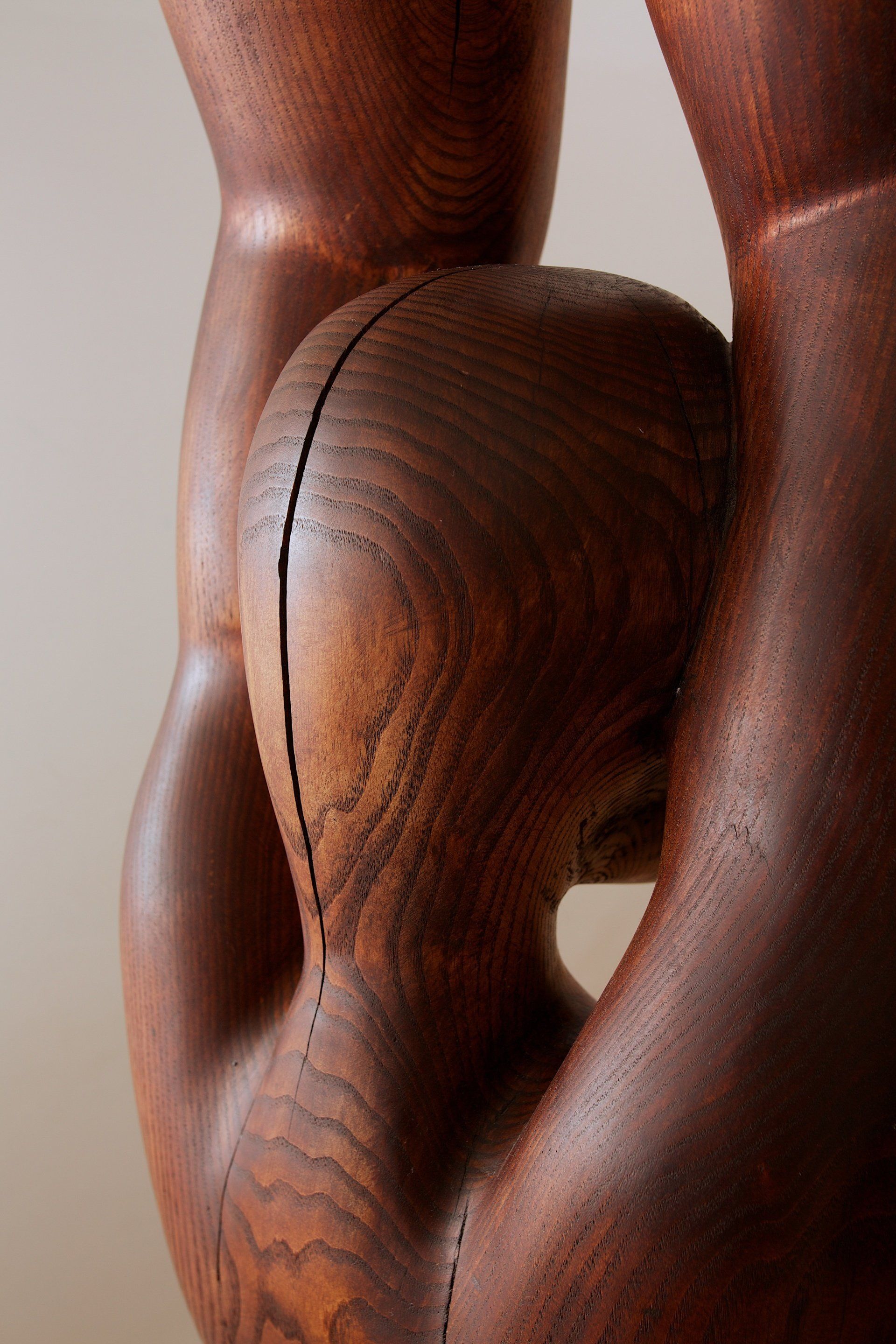 A close up of a wooden sculpture on a table.