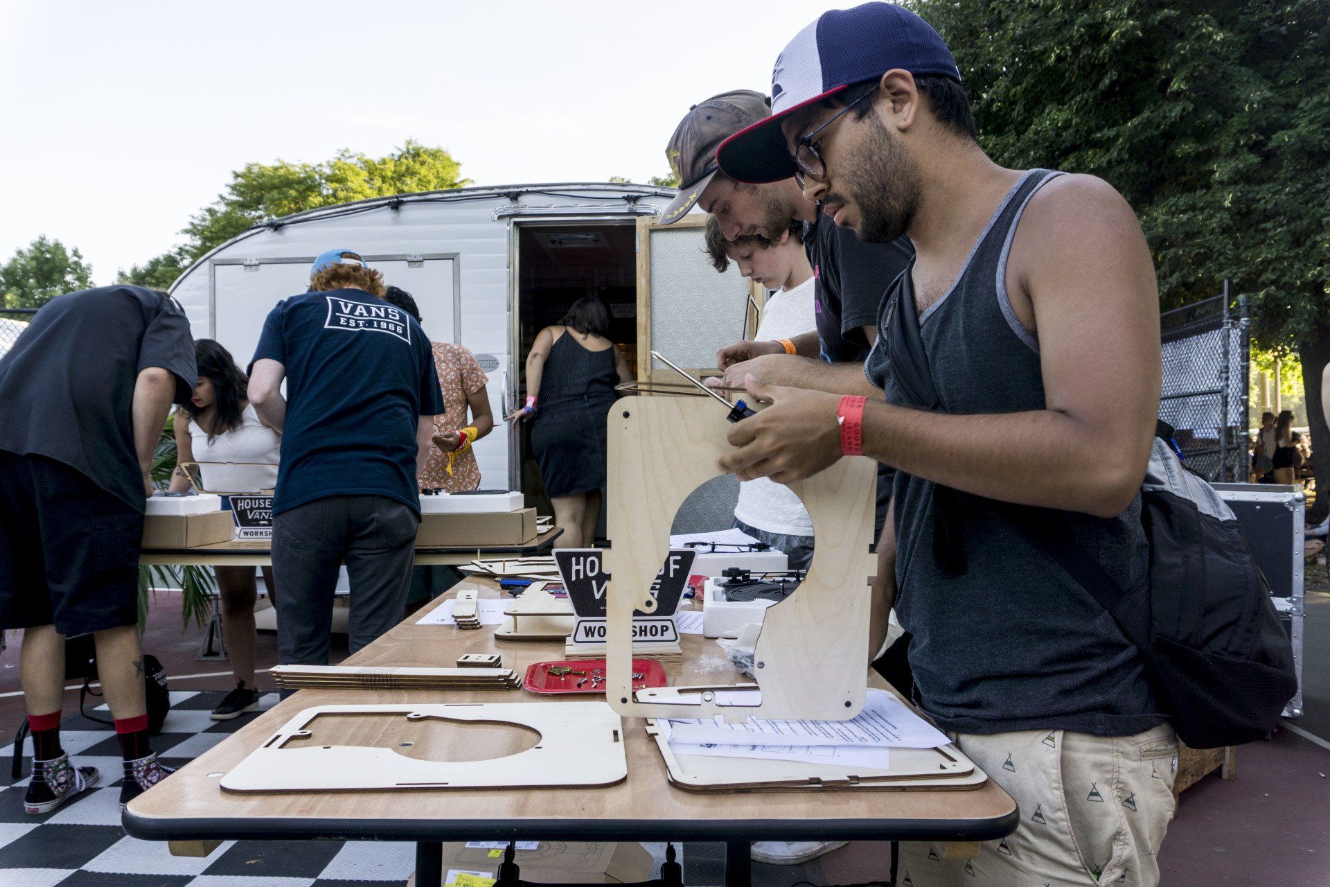 A group of people are working on a project at a table.