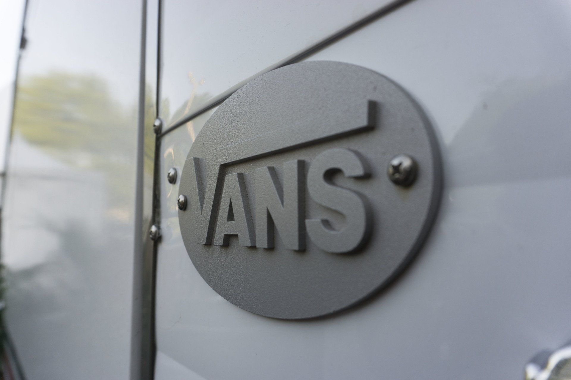 A vans logo is on the side of a van