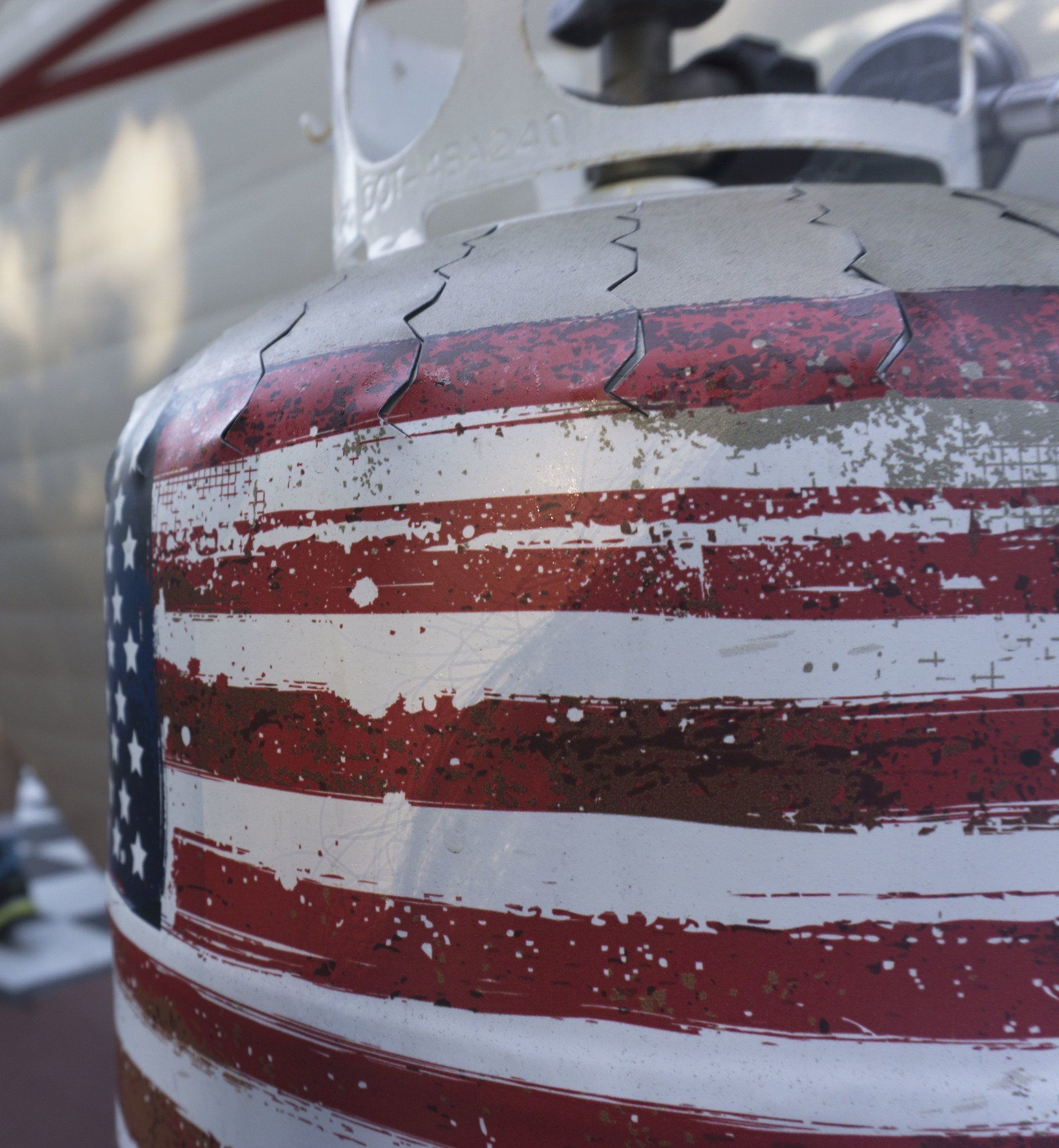 A propane tank with an american flag painted on it