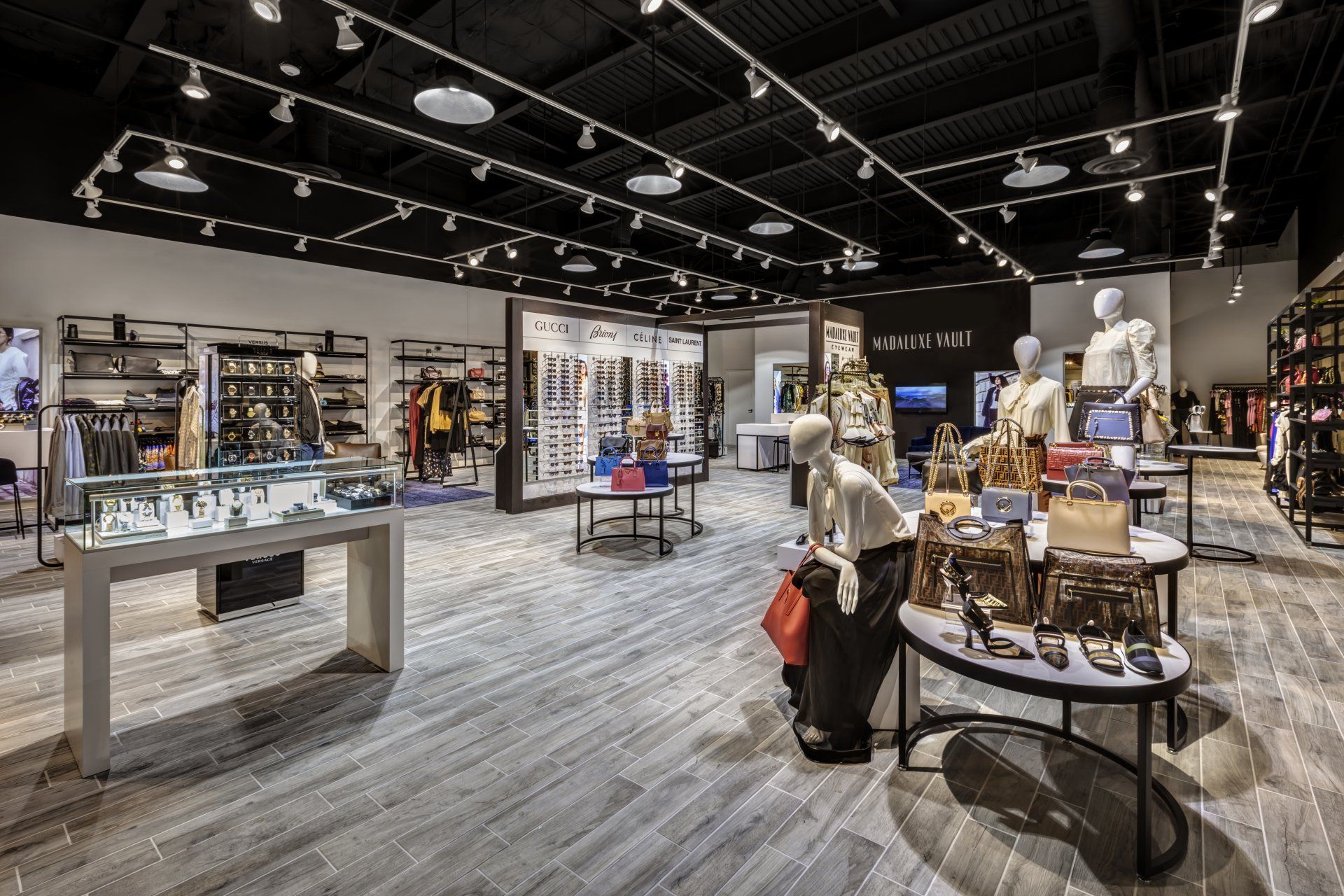A large store filled with lots of tables and mannequins.