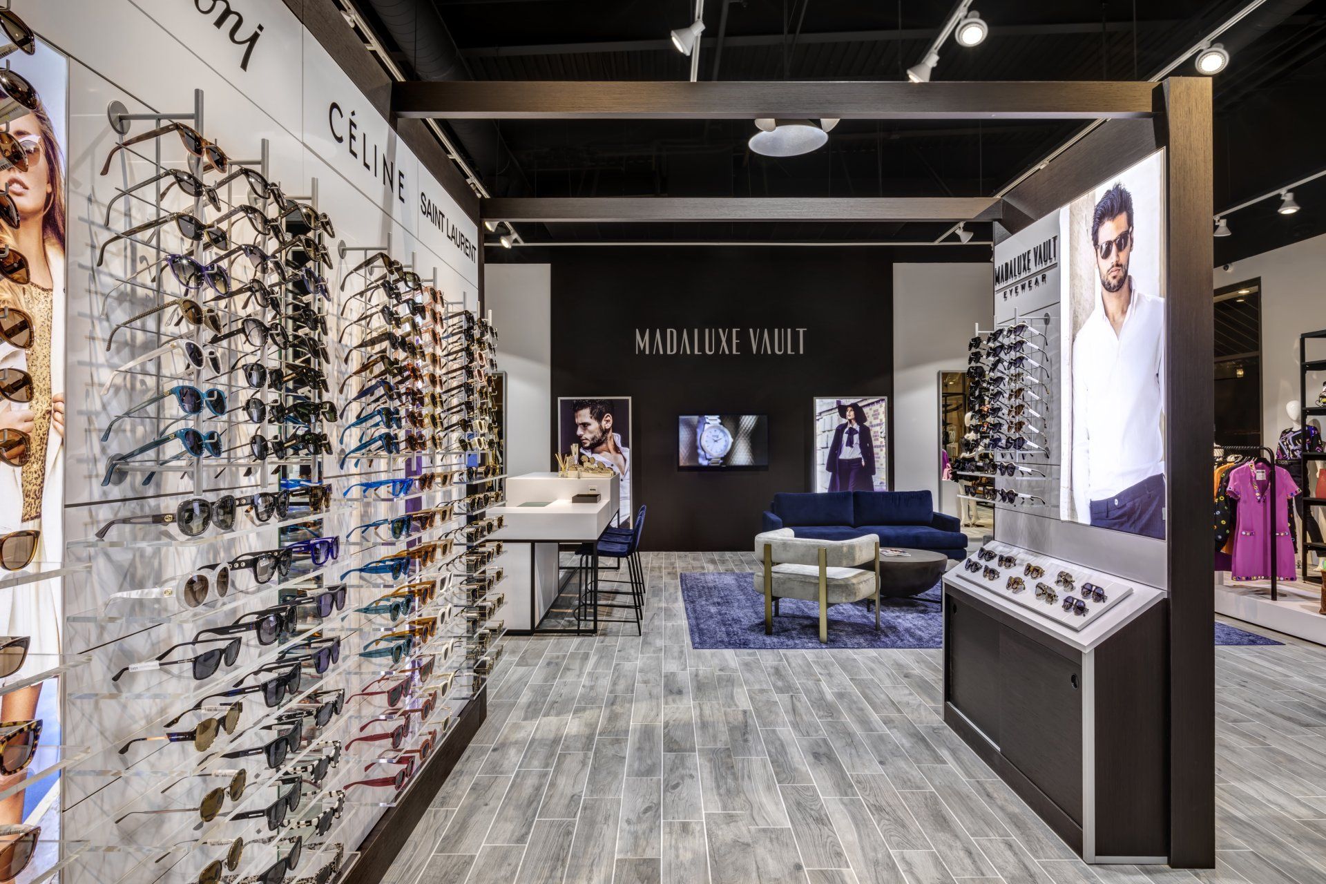 A store filled with lots of sunglasses and a couch.