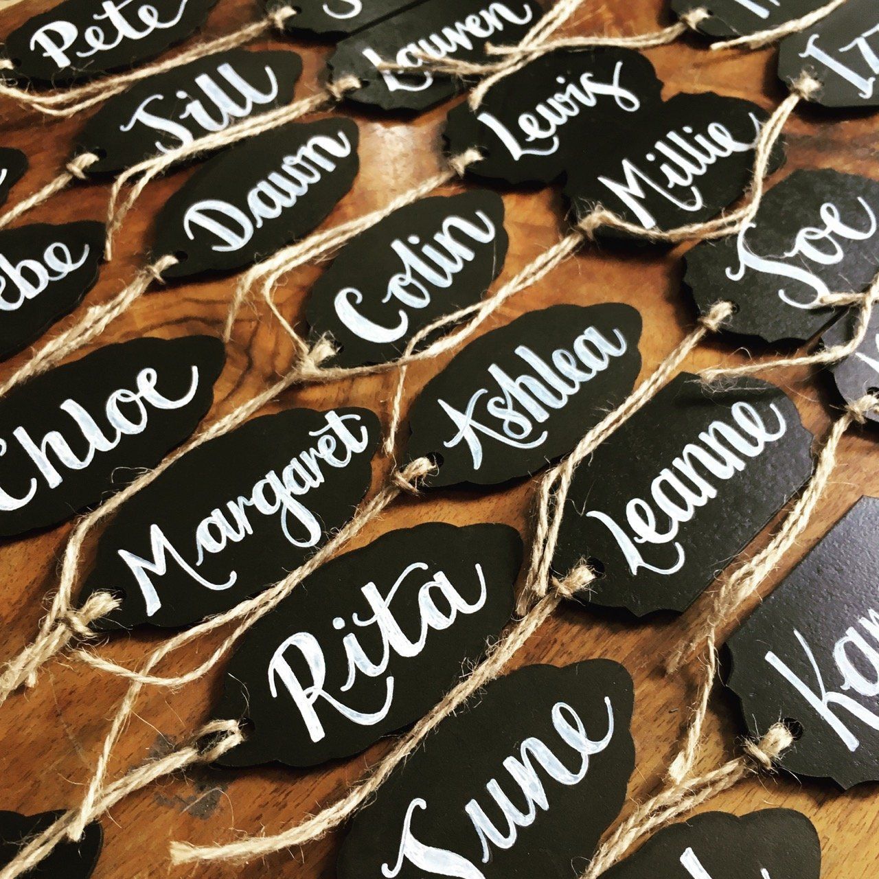 A bunch of place cards with names on them